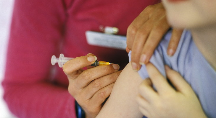 Child receiving a vaccine injection.
