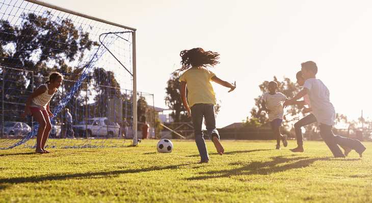 Children playing football.