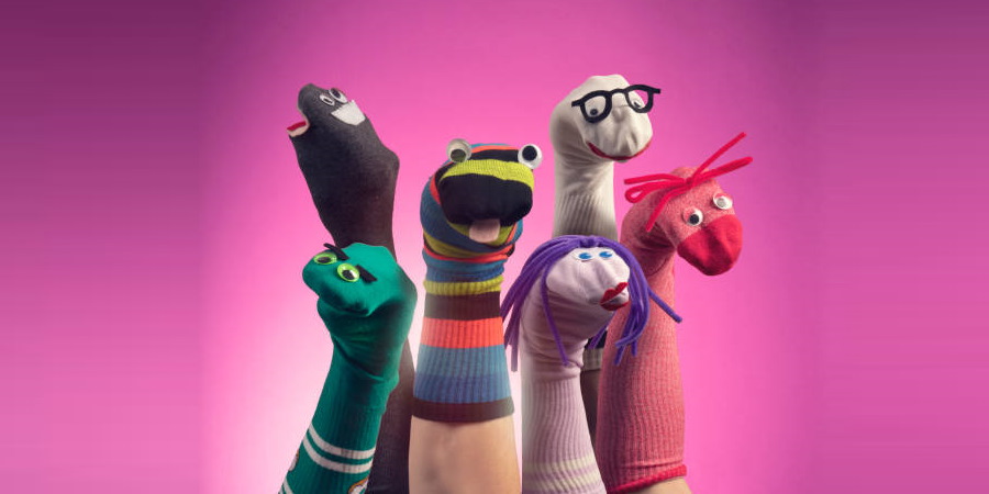 A collection of hands wearing sock puppets.