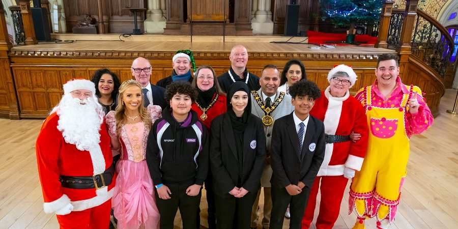 Councillor Shakil Ahmed, consort councillor Rachel Massey and guests including Father Christmas, Mrs Christmas, Middleton Arena pantomime stars, Falinge Park High School pupils and local councillors.