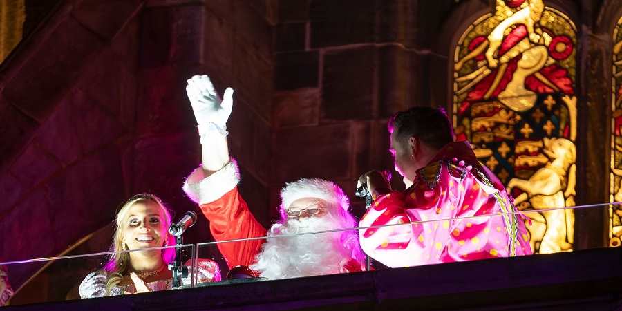 Father Christmas and guests on the town hall balcony.