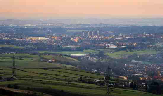 Littleborough and Rochdale at dusk, seen from Blackstone Edge.