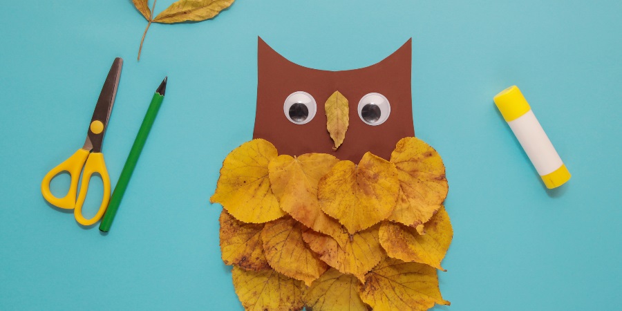 Owl made of crafting materials and leaves.