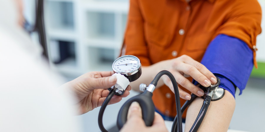 A person having their blood pressure checked.