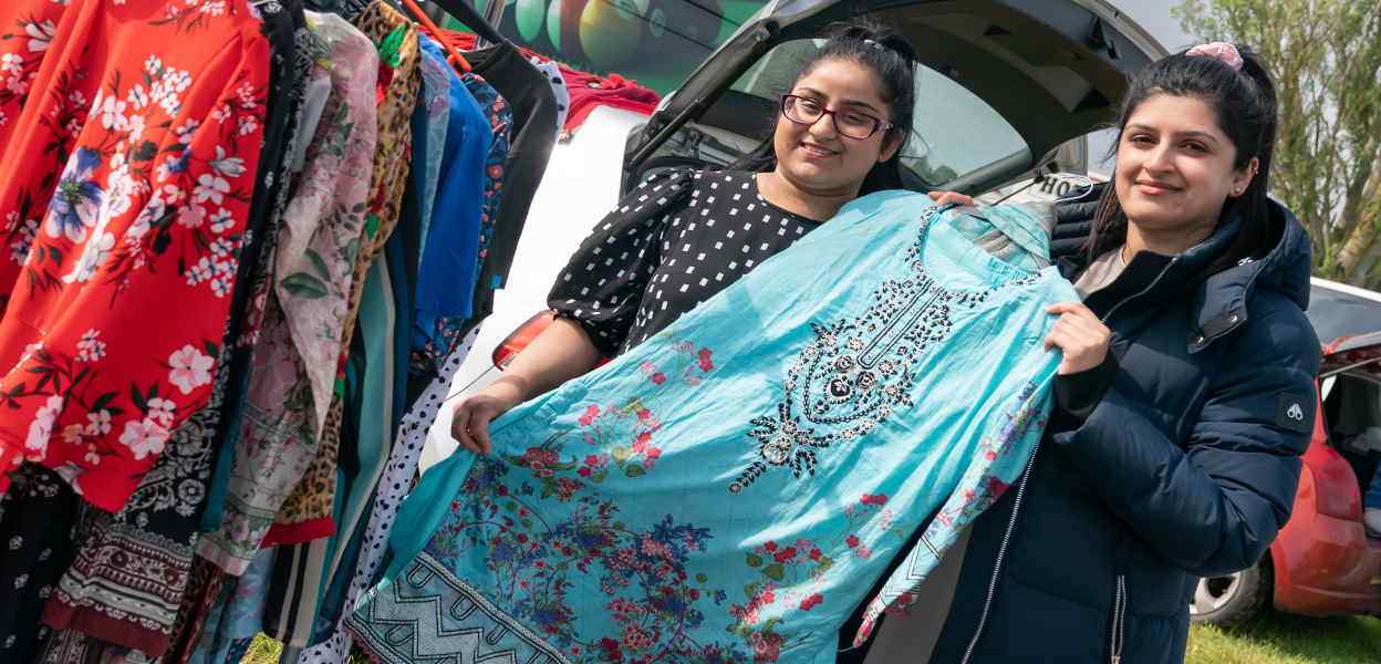 2 visitors to Bowlee Car Boot Sale with a dress.