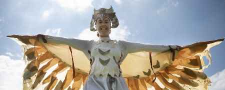 Performer in a bird costume.