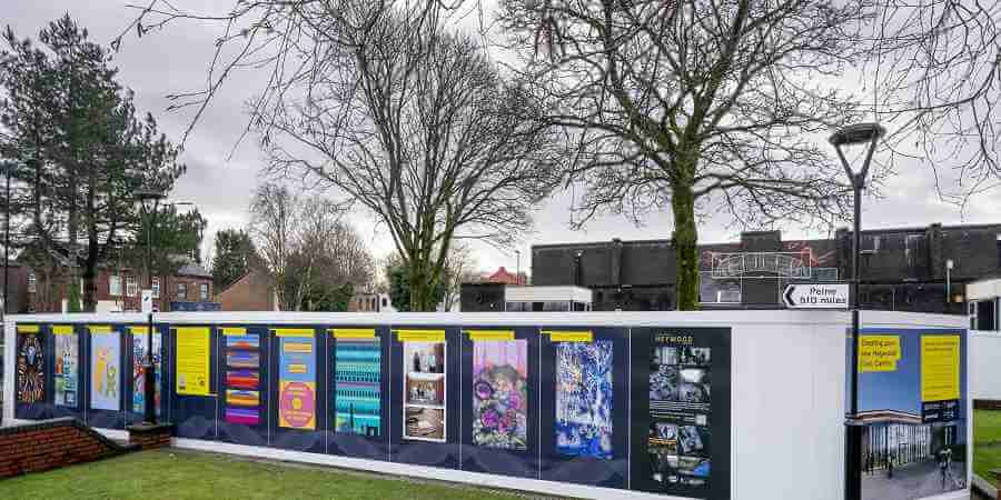 Hoardings with artwork in Heywood.