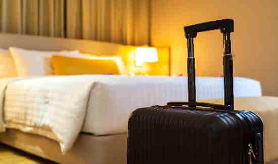 Suitcase in a hotel room.