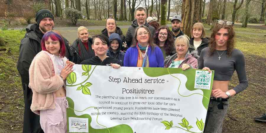 Young people with Councillor Rachel Massey holding up a Steps Ahead sign.