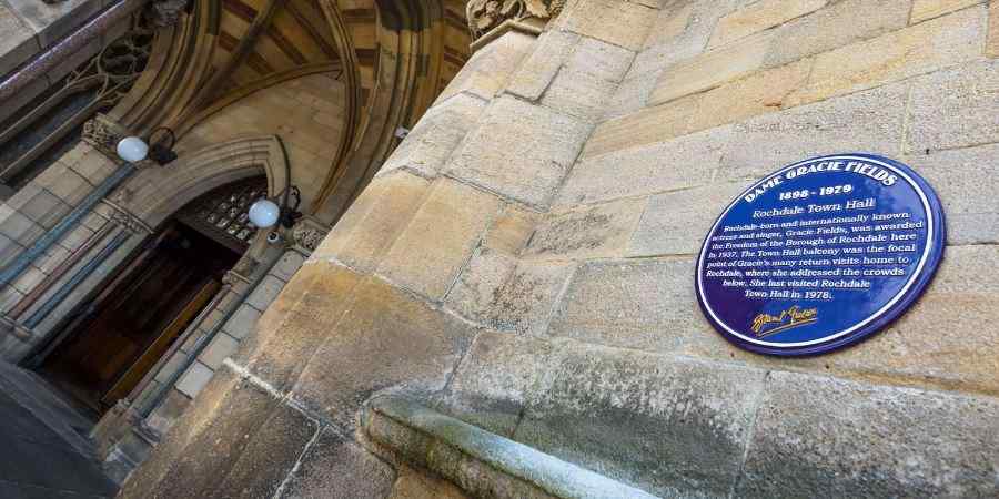 Purple plaque at Rochdale Town Hall.