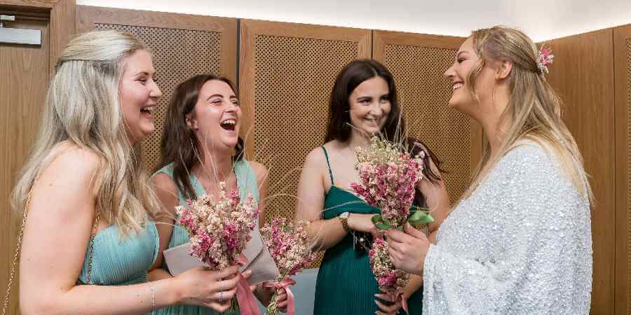 Bride with bridesmaids in the Register Office.