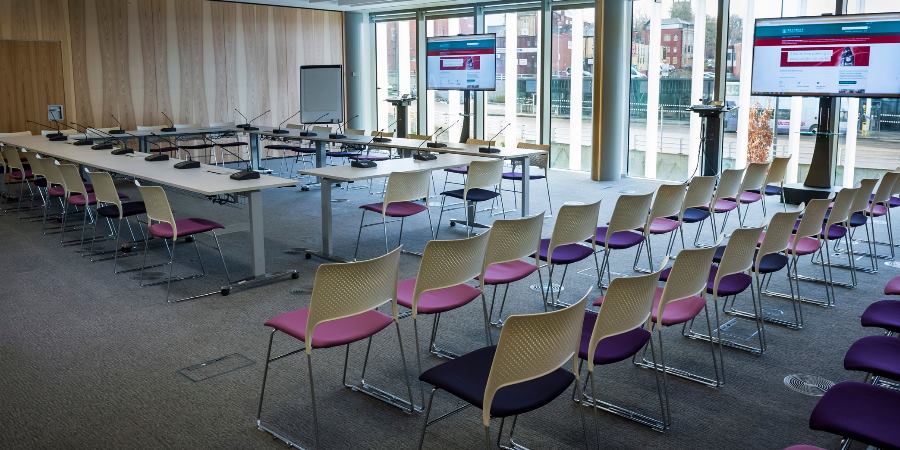 Meeting room set up with tables.