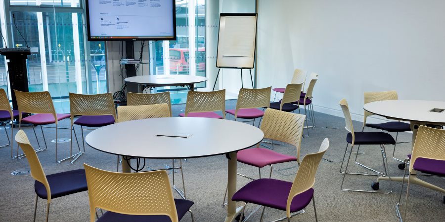 Meeting room set up with tables.