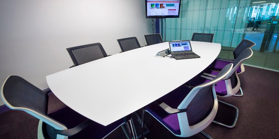 Meeting room with set up with table and chairs.