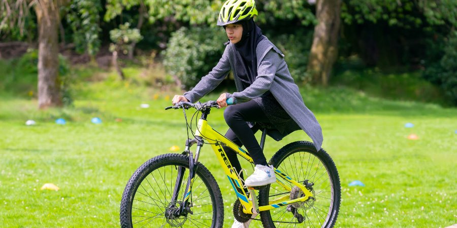 Cyclist in a park.