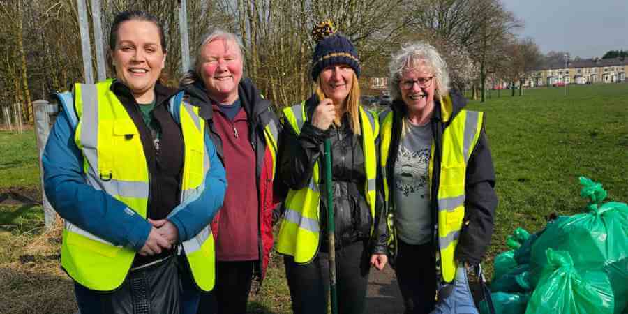 Councillor Angela Brown with litter pickers.