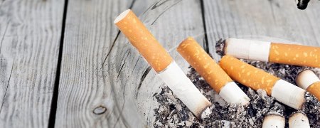 Ashtray with used cigarettes.