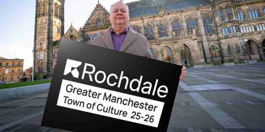 Councillor Neil Emmott holding sign reading, Rochdale, Greater Manchester Town of Culture 25-26.