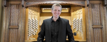Jonathan Scott in front of the town hall organ.