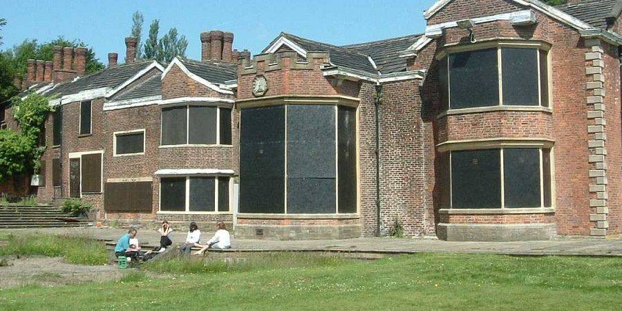 Hopwood Hall with its windows boarded up.