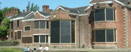 Hopwood Hall with its windows boarded up.