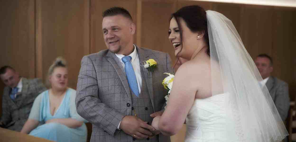 A couple getting married in the Red Rose Suite.