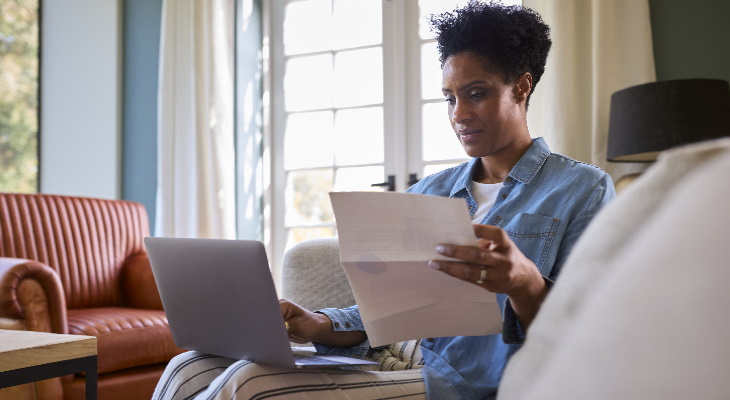 Woman reading bills.