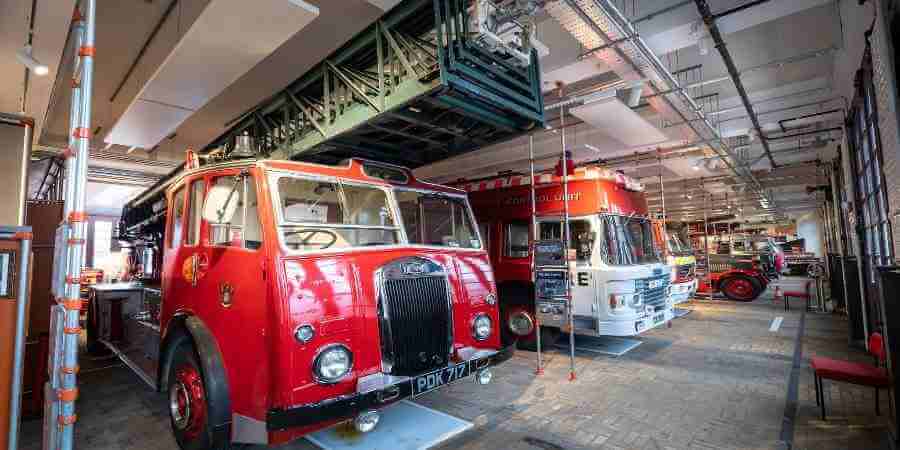 A row of vintage fire engines parked in the main garage.