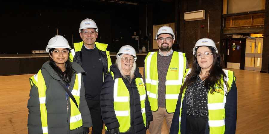 Preena Mistry, Shaun Smith with Councillors Sue Smith, Danny Meredith and Angela Brown in high viz jackets standing in Heywood Civic Centre.